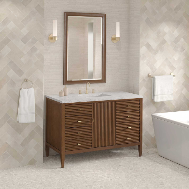 Includes Eternal Jasmine Pearl quartz vanity top and rectangular sink (may not be pictured on main image)

Included Components:

Covered under James Martin Vanities' 1 year limited warranty
Ash, poplar and walnut vanity cabinet with 1 door, 6 drawers and 1 shelf
Silestone quartz vanity top with 1 rectangular porcelain sink
Cabinet Features:

Constructed with a solid wood frame and plywood panels
One 120-volt UL rated electric outlet with USB ports and bamboo organizer included
Includes one soft-close door that opens to an interior shelf and three full-extension drawers that feature soft-close undermount glides
Toggle style door pulls
The drawer boxes feature English dovetail joinery, and an brushed aluminum laminate drawer liners for easy cleaning
Includes one removable bamboo drawer organizer
Cabinets are sealed with a premium finish for superior moisture and UV resistance
Vanity Top Features:

Vanity set includes a 3cm eased edge Eternal Jasmine Pearl quartz Silestone quartz top
Includes a white porcelain rectangular undermount sink that ships separately and mounting brackets for easy installation
Top is pre-drilled for 8" widespread faucet
Faucet not included
Quartz vanity tops are curated from a 95 percent blend of ground natural quartz with 5 percent polymer resin to create an ultra-durable and low maintenance surface
Quartz requires no sealing and resists staining and corrosion from liquids, including most household cleaning products
Center drain location provides optimal draining capability
Equipped with an overflow to help prevent water overflow and spillage from occurring
Cabinet Specifications:

Cabinet Width: 48" (from left to right)
Cabinet Height: 34-1/16" (from top to bottom)
Cabinet Depth: 23-1/2" (from front to back)
Number of Doors: 1
Number of Drawers: 6
Number of Shelves: 1
Vanity Top Specifications:

Vanity Top Width: 48" (left edge to right edge)
Vanity Top Depth: 23-1/2" (front edge to back edge)
Vanity Top Thickness: 3 cm (1-3/16")
Number of Basins: 1
Number of Faucet Holes: 3
Faucet Centers: 8" (distance between the installation holes for the faucet handles)