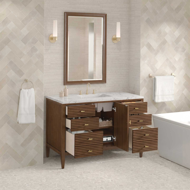 Includes Eternal Jasmine Pearl quartz vanity top and rectangular sink (may not be pictured on main image)

Included Components:

Covered under James Martin Vanities' 1 year limited warranty
Ash, poplar and walnut vanity cabinet with 1 door, 6 drawers and 1 shelf
Silestone quartz vanity top with 1 rectangular porcelain sink
Cabinet Features:

Constructed with a solid wood frame and plywood panels
One 120-volt UL rated electric outlet with USB ports and bamboo organizer included
Includes one soft-close door that opens to an interior shelf and three full-extension drawers that feature soft-close undermount glides
Toggle style door pulls
The drawer boxes feature English dovetail joinery, and an brushed aluminum laminate drawer liners for easy cleaning
Includes one removable bamboo drawer organizer
Cabinets are sealed with a premium finish for superior moisture and UV resistance
Vanity Top Features:

Vanity set includes a 3cm eased edge Eternal Jasmine Pearl quartz Silestone quartz top
Includes a white porcelain rectangular undermount sink that ships separately and mounting brackets for easy installation
Top is pre-drilled for 8" widespread faucet
Faucet not included
Quartz vanity tops are curated from a 95 percent blend of ground natural quartz with 5 percent polymer resin to create an ultra-durable and low maintenance surface
Quartz requires no sealing and resists staining and corrosion from liquids, including most household cleaning products
Center drain location provides optimal draining capability
Equipped with an overflow to help prevent water overflow and spillage from occurring
Cabinet Specifications:

Cabinet Width: 48" (from left to right)
Cabinet Height: 34-1/16" (from top to bottom)
Cabinet Depth: 23-1/2" (from front to back)
Number of Doors: 1
Number of Drawers: 6
Number of Shelves: 1
Vanity Top Specifications:

Vanity Top Width: 48" (left edge to right edge)
Vanity Top Depth: 23-1/2" (front edge to back edge)
Vanity Top Thickness: 3 cm (1-3/16")
Number of Basins: 1
Number of Faucet Holes: 3
Faucet Centers: 8" (distance between the installation holes for the faucet handles)
